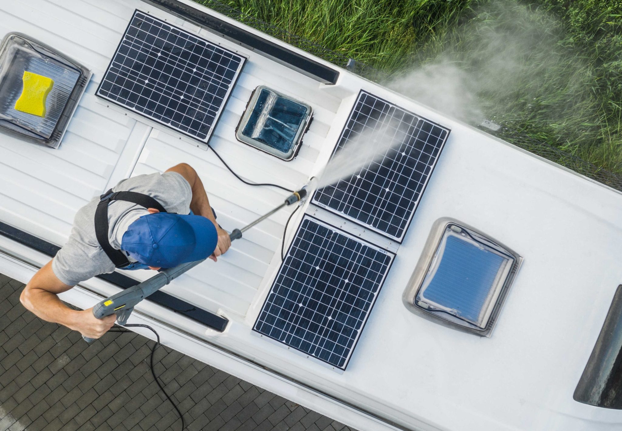 Location and Directions men power washing his camper van rv roof and solar 2022 12 16 11 50 54 utc optimized scaled