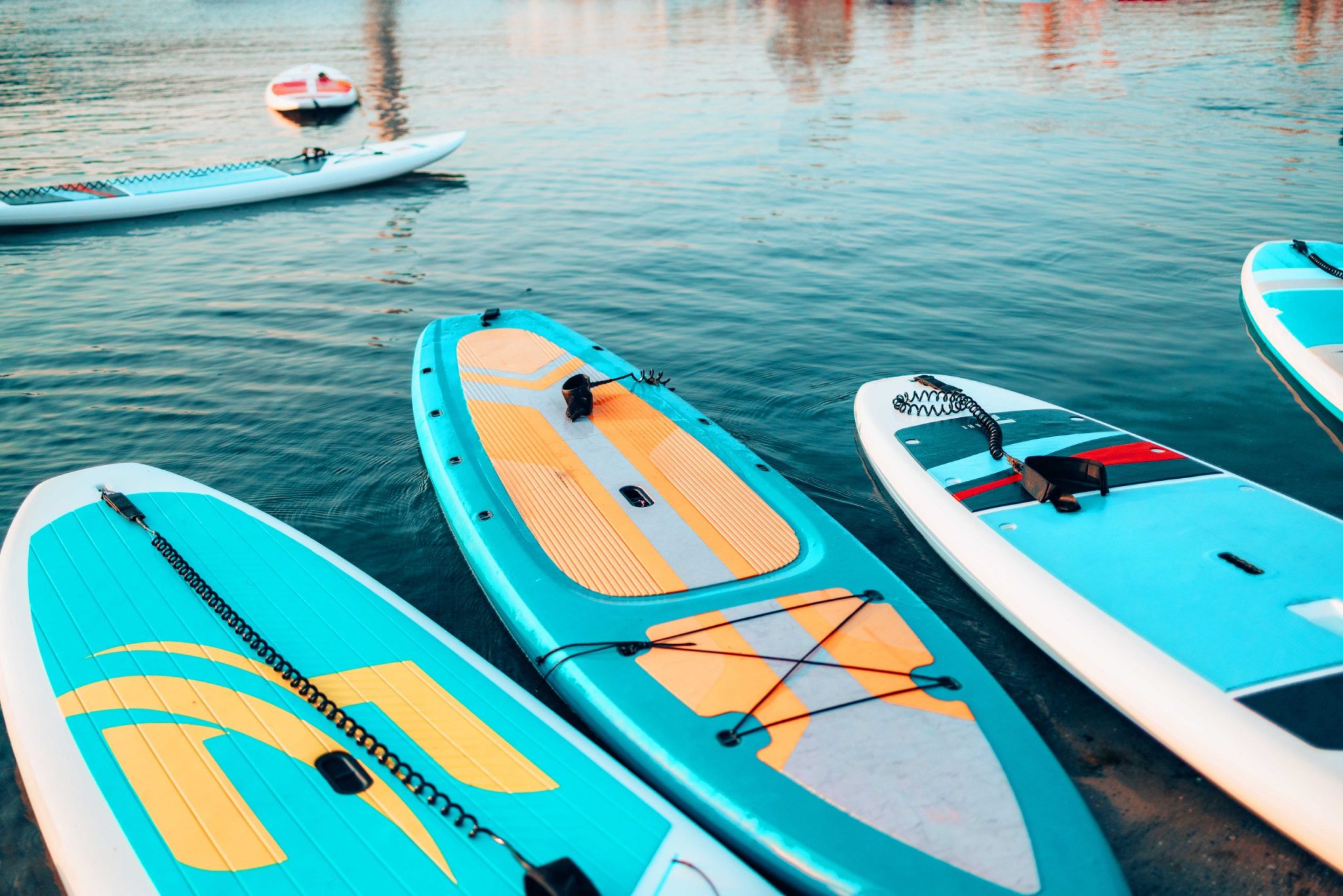 Standup Paddle Board Rentals sup stand up paddle board on the background blue w 2023 11 27 05 18 21 utc optimized scaled  Product Single Template sup stand up paddle board on the background blue w 2023 11 27 05 18 21 utc optimized scaled